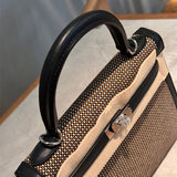 Side view of refined structured handbag