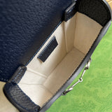 Side profile of sleek structured women's handbag – women's designer-style accessory