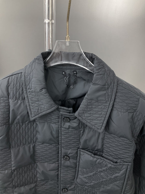 Close-up detail shot of Louis Vuitton luxury clothing with label-forward styling
