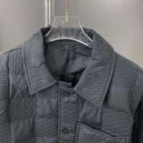 Close-up detail shot of Louis Vuitton luxury clothing with label-forward styling