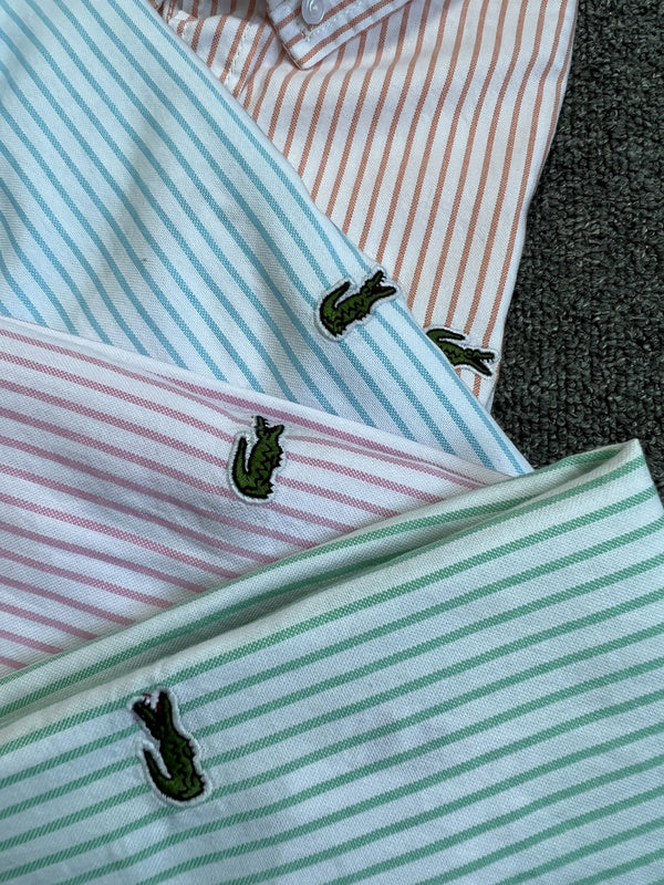 Side profile of Lacoste luxury clothing with logo-detail design