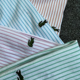 Side profile of Lacoste luxury clothing with logo-detail design
