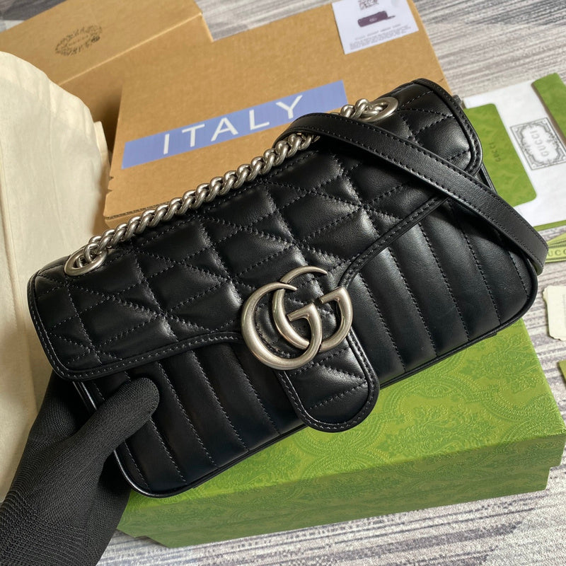 Styled lifestyle shot of polished signature women's handbag – women's luxury accessory