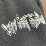 Front view of Louis Vuitton luxury clothing with signature branding