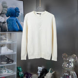 Front view of Louis Vuitton luxury clothing with signature branding