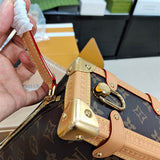  refined top-handle bag styled with outfit