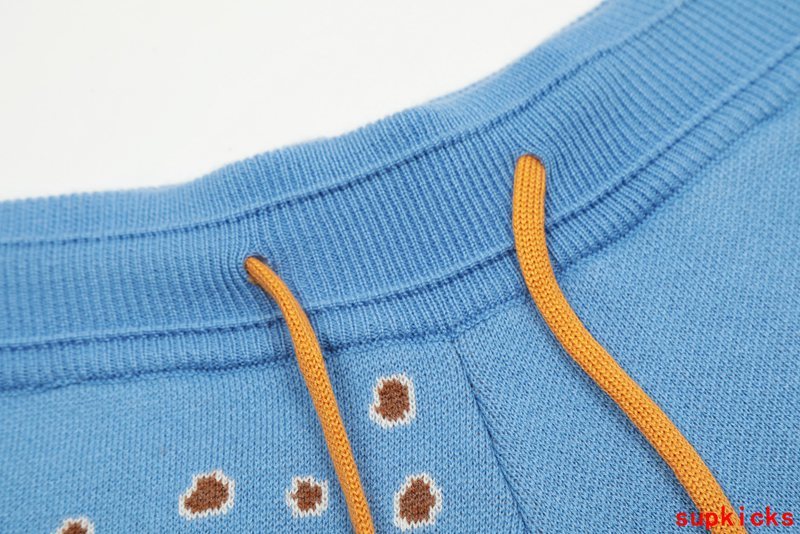 Close-up detail shot of Rhude luxury clothing with label-forward styling