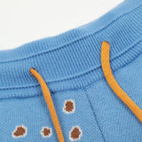Close-up detail shot of Rhude luxury clothing with label-forward styling