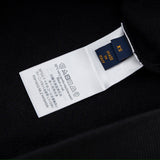 Close-up detail shot of Louis Vuitton luxury clothing with relaxed-fit cut