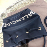 Back view of elevated polished women's handbag – women's luxury handbag