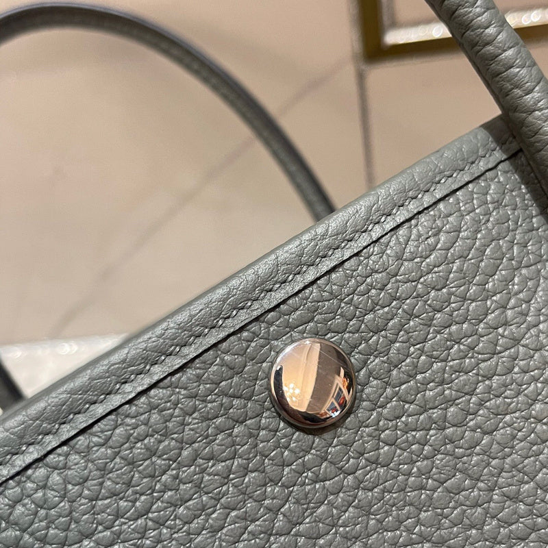 Side view of versatile structured handbag