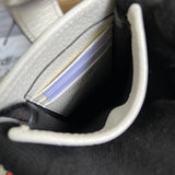 Front view of sleek refined women's handbag – women's luxury accessory