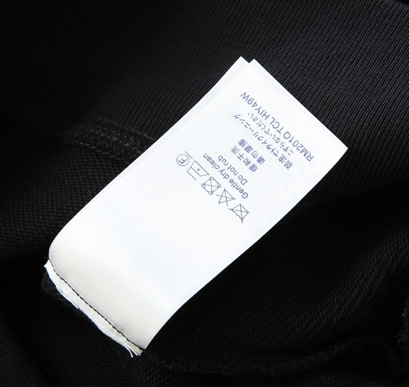Close-up detail shot of Louis Vuitton luxury clothing with tailored silhouette