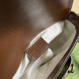 Side profile of sleek polished women's handbag – women's everyday handbag
