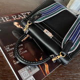Side view of streamlined structured handbag