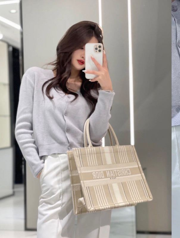 Side profile of modern statement women's handbag – women's luxury accessory