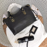 Front view of structured premium women's handbag – women's luxury accessory