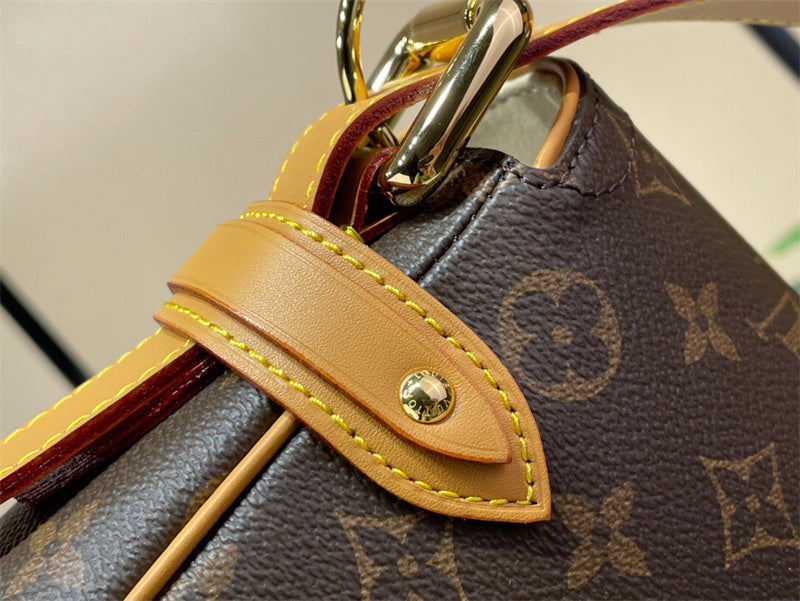  Understated top-handle bag carried on shoulder