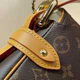  Understated top-handle bag carried on shoulder