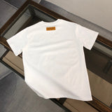 Close-up detail shot of Louis Vuitton cotton t-shirt with runway-inspired design