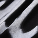 Front view of Gucci luxury clothing with monogram-inspired silhouette