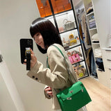  Structured tote bag carried on shoulder