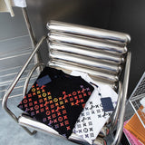 Close-up detail shot of Louis Vuitton cotton t-shirt with signature branding