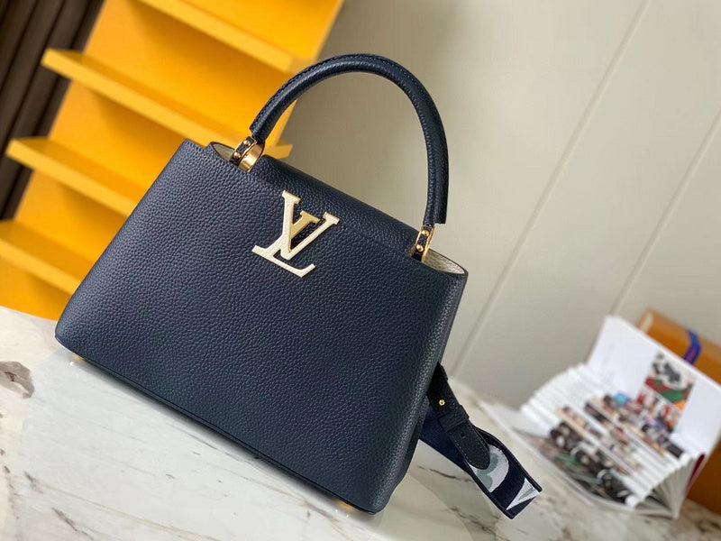 Side profile of polished refined women's handbag – women's statement bag