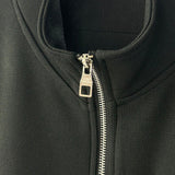 Close-up detail shot of Louis Vuitton luxury clothing with runway-inspired design