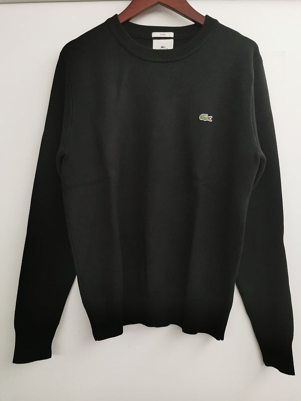 Flat lay presentation of Lacoste luxury clothing with logo-detail design