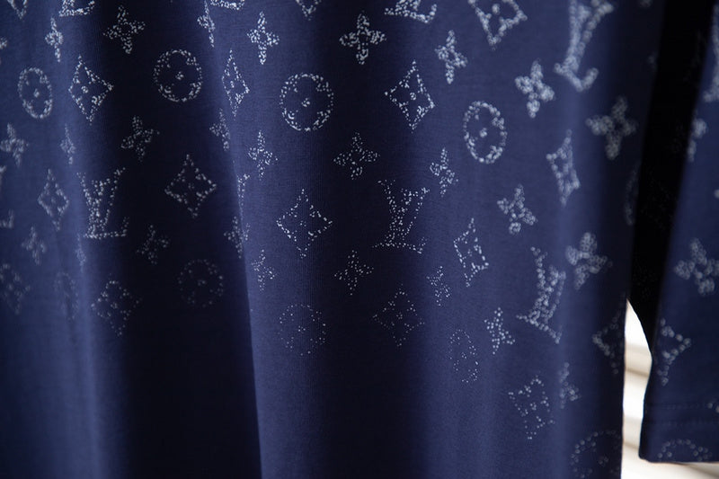 Flat lay presentation of Louis Vuitton cotton t-shirt with signature branding
