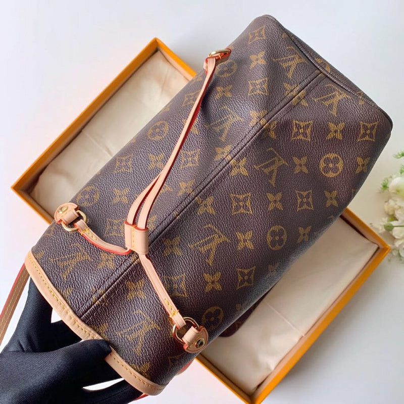 Side profile of elevated signature women's handbag – women's luxury accessory