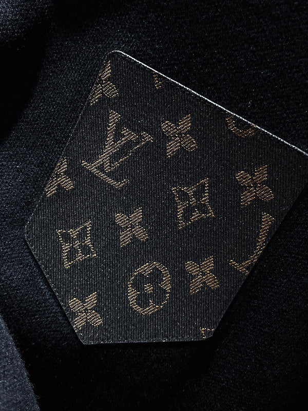Flat lay presentation of Louis Vuitton luxury clothing with relaxed-fit cut