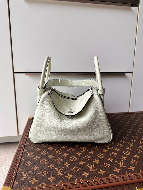  Timeless top-handle bag carried on shoulder 28