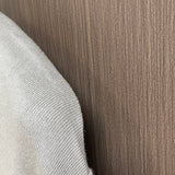 Close-up detail shot of Louis Vuitton luxury clothing with signature branding