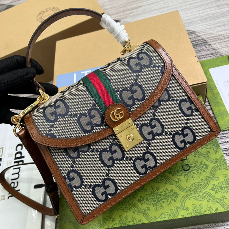 Handle and strap detail of structured modern women's handbag – women's designer-style accessory