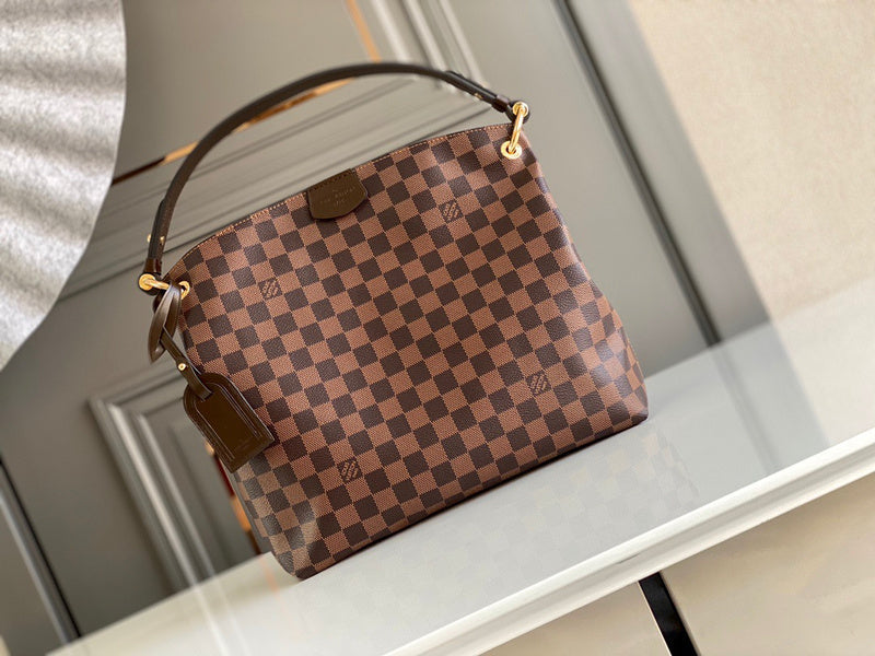 Front view of signature sleek women's handbag – women's luxury handbag