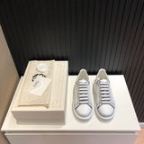 Alexander McQueen soft grey luxury sneakers view 9 chunky sole construction