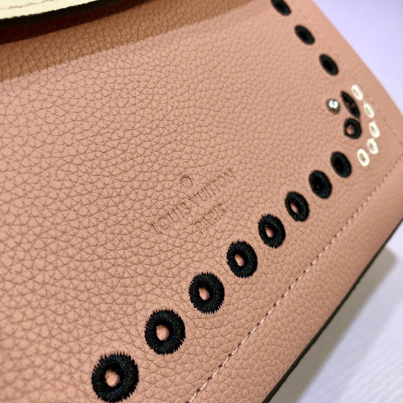 Handle and strap detail of structured signature women's handbag – women's statement bag