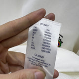 Side profile of Louis Vuitton luxury clothing with logo-detail design