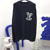 Close-up detail shot of Louis Vuitton luxury clothing with relaxed-fit cut