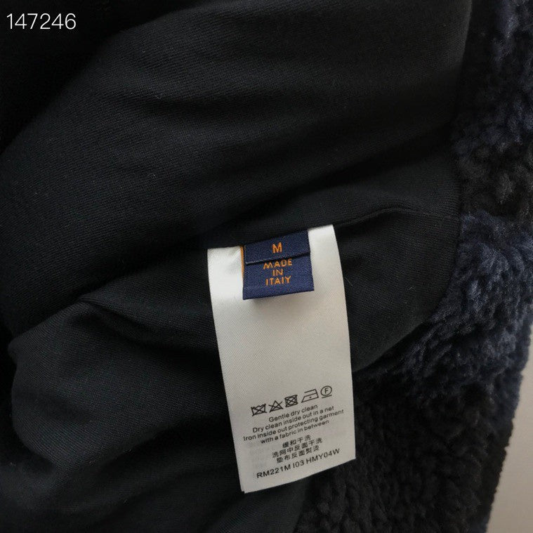 Side profile of Louis Vuitton luxury clothing with signature branding