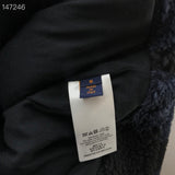 Side profile of Louis Vuitton luxury clothing with signature branding