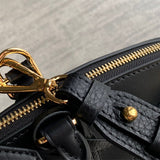  Polished top-handle bag carried on shoulder