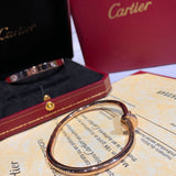 Angled view of Cartier unisex jewelry piece