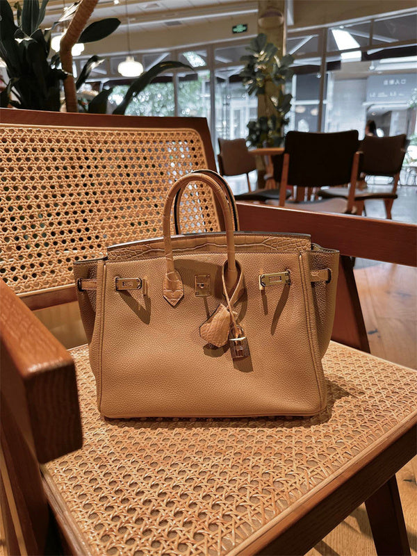  Sleek top-handle bag carried on shoulder 22