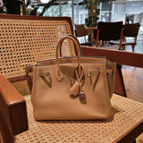  Sleek top-handle bag carried on shoulder 22