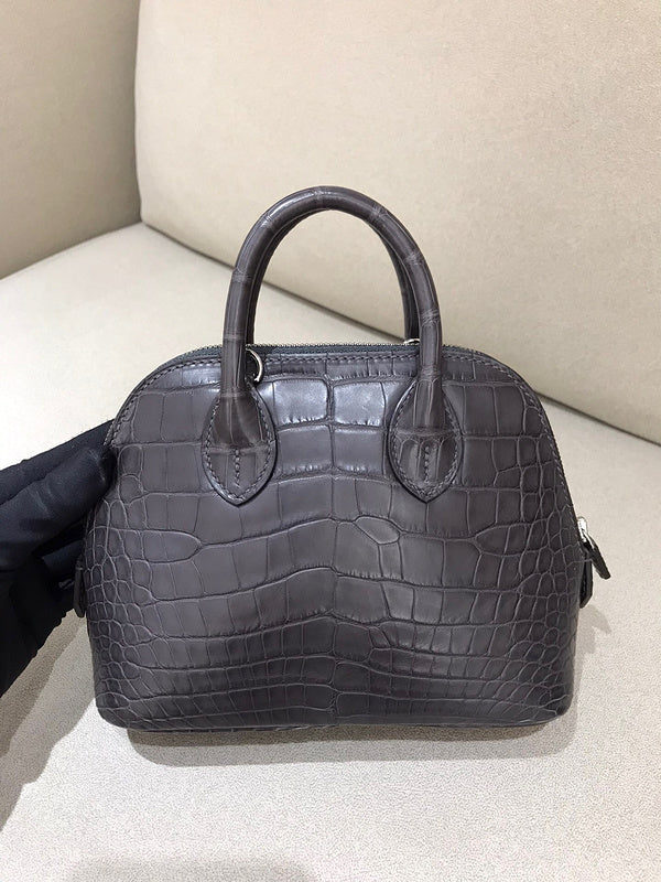 Side view of sleek structured handbag