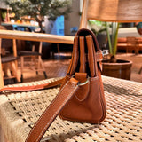 Side view of polished structured handbag