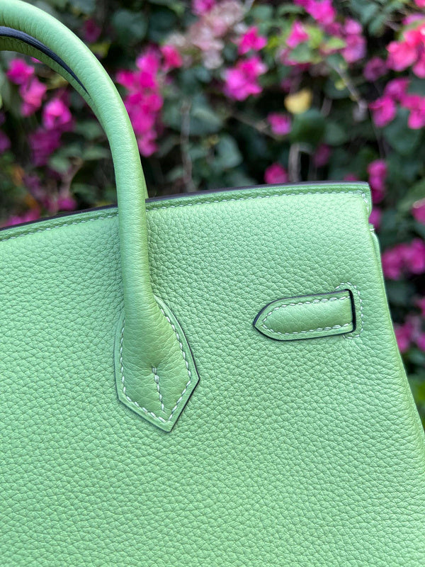 Side view of sculpted structured handbag